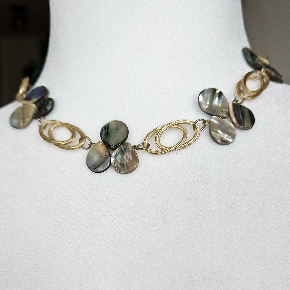 Blue mother of perl necklace with gold tone links